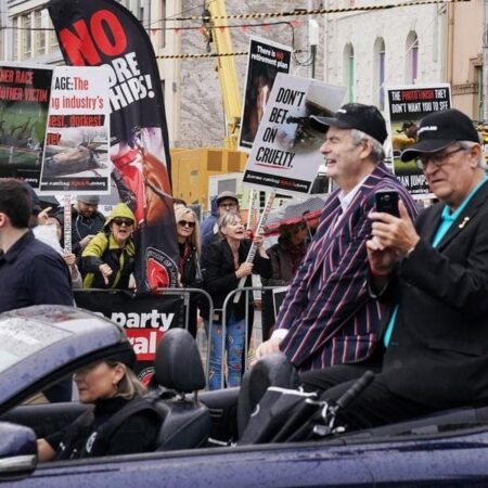 Cup parade attracts crowds and protesters